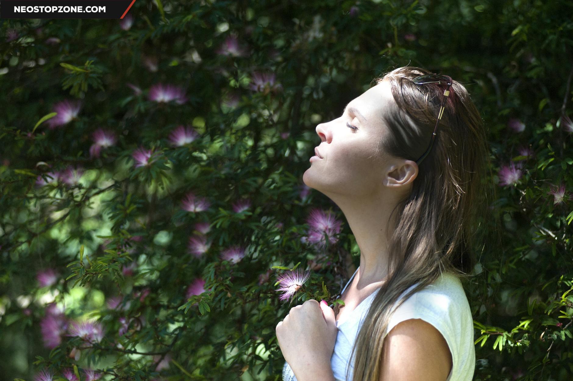 https://www.pexels.com/photo/woman-closing-her-eyes-against-sun-light-standing-near-purple-petaled-flower-plant-321576/