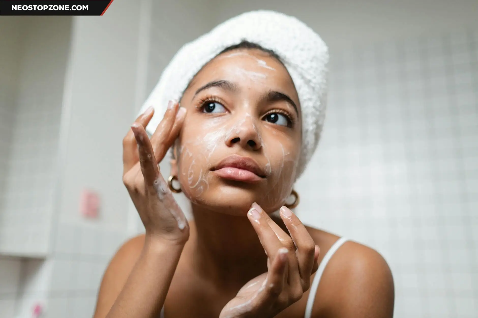 https://www.pexels.com/photo/woman-in-white-tank-top-washing-her-face-with-soap-8142198/